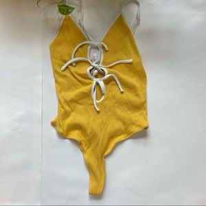 Out From Under Yellow Triple Front Cutouts with Ties Bodysuit